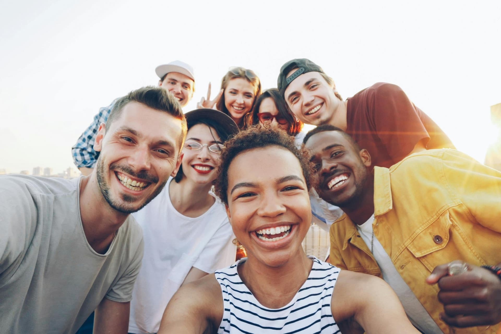 A smiling group of friends gathered together